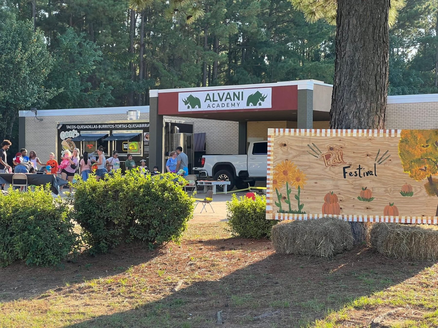 Children and families gathered on the Alvani Academy outdoor campus in Longview, Texas