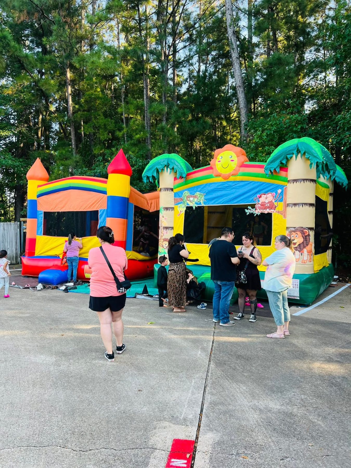 Families and children gathered for an outdoor event or celebration at Alvani Academy
